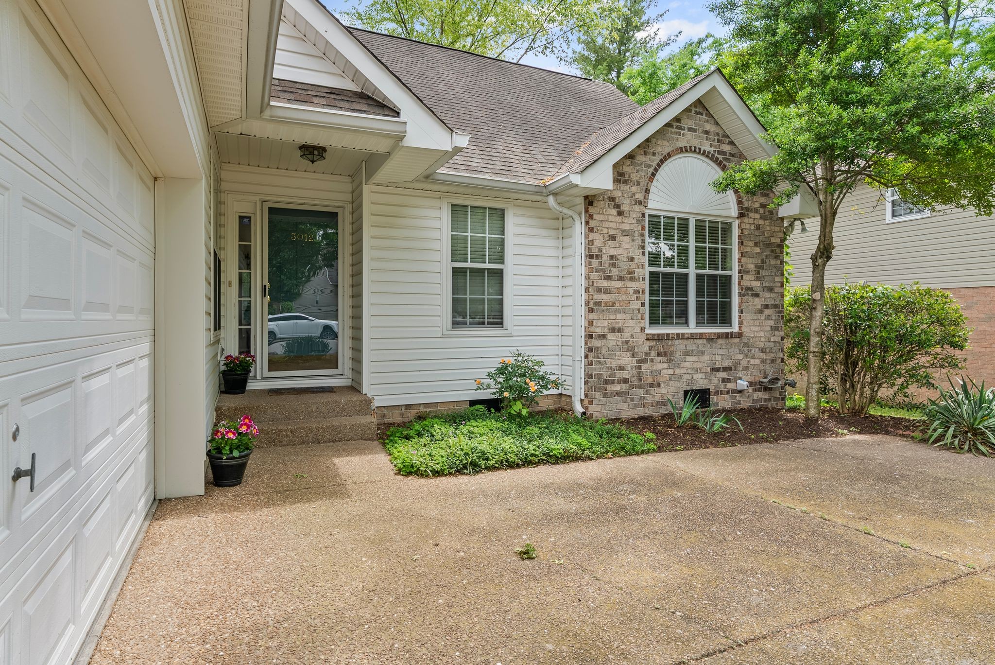 3012 Bent Tree Road Franklin, TN 37067 - Photo 6 of 34 a front view of a house with a yard