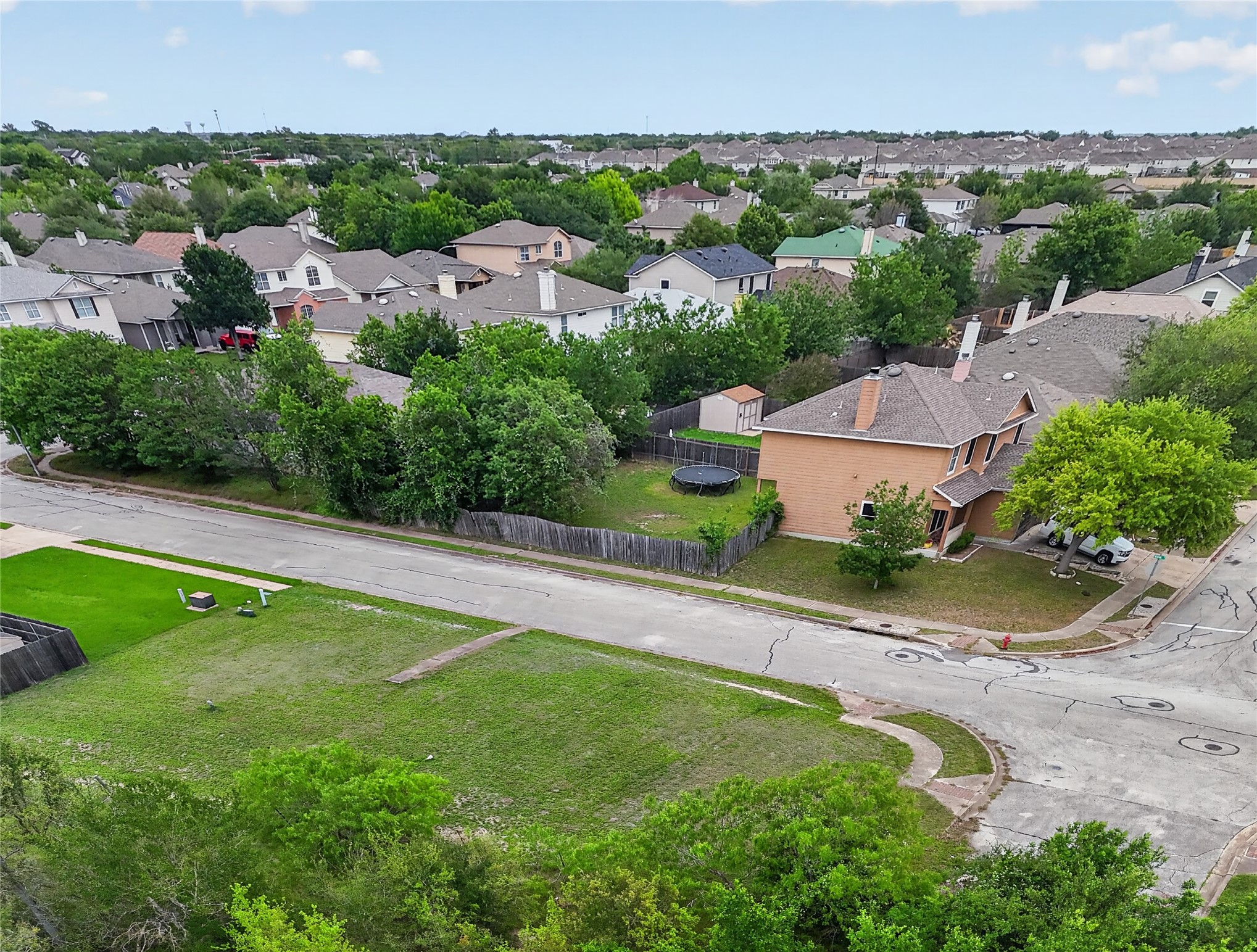 11908 Athens Street Manor, TX 78653 - Photo 14 of 15 This property is situated on a corner lot, featuring a fenced backyard with a storage shed