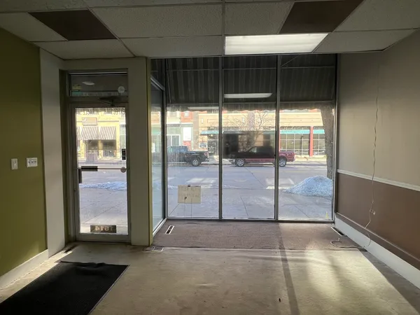 a view of a hallway with a glass door