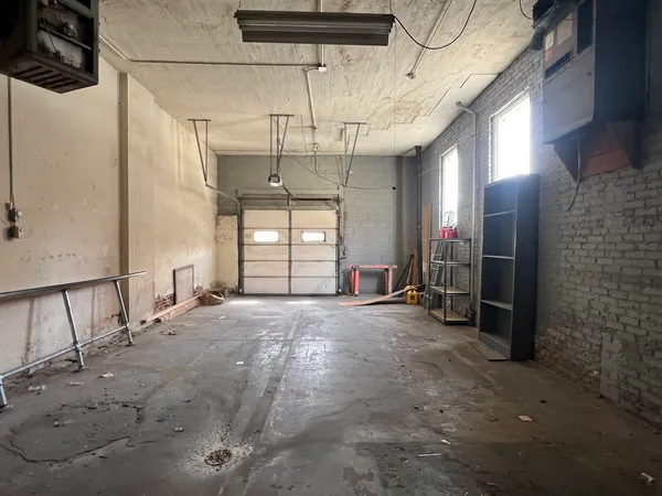 a view of empty room with a fireplace
