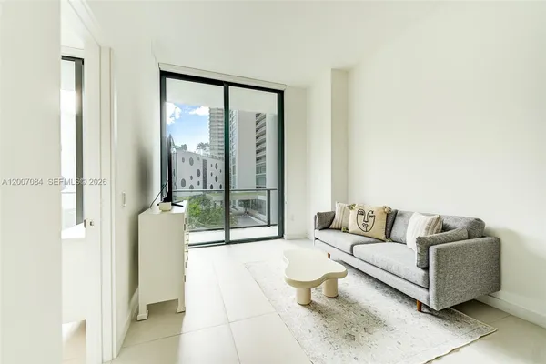 a balcony view with a glass door