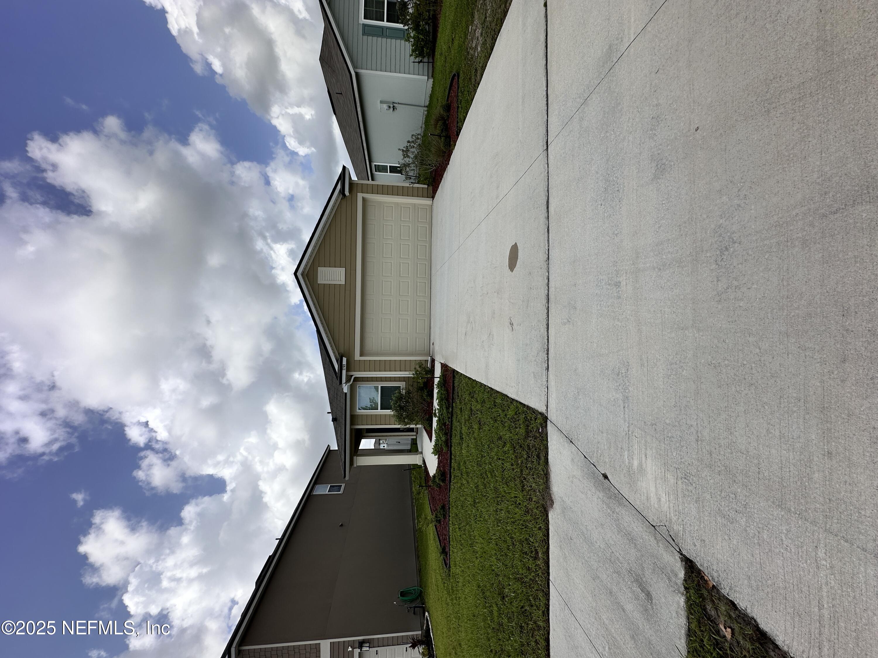 2769 Oak Strm Drive Green Cove Springs, FL 32043 - Photo 1 of 17 a front view of a house with a yard and garage