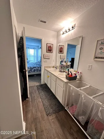a kitchen with sink refrigerator and stove