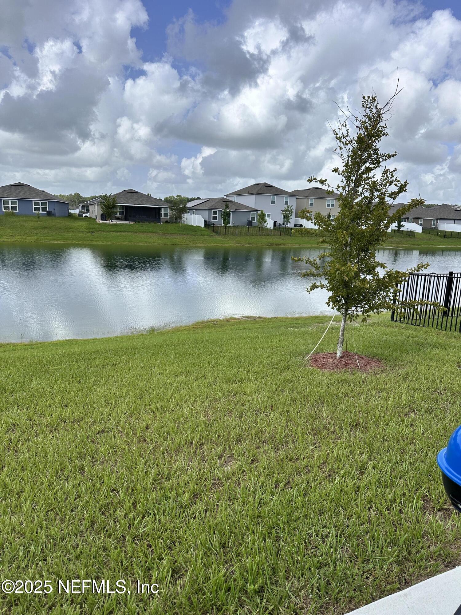 2769 Oak Strm Drive Green Cove Springs, FL 32043 - Photo 15 of 17 a view of a lake with houses in the back