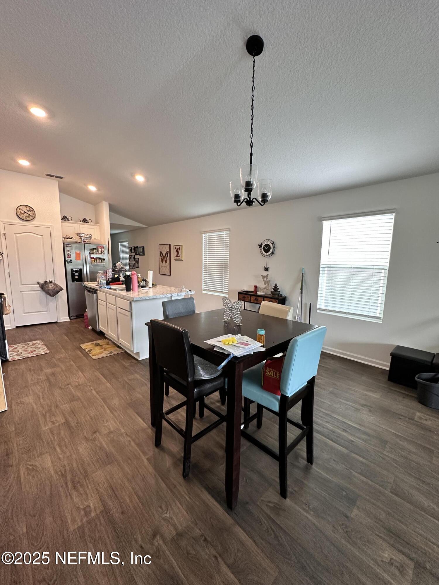 2769 Oak Strm Drive Green Cove Springs, FL 32043 - Photo 3 of 17 a view of a dining room with furniture and wooden floor