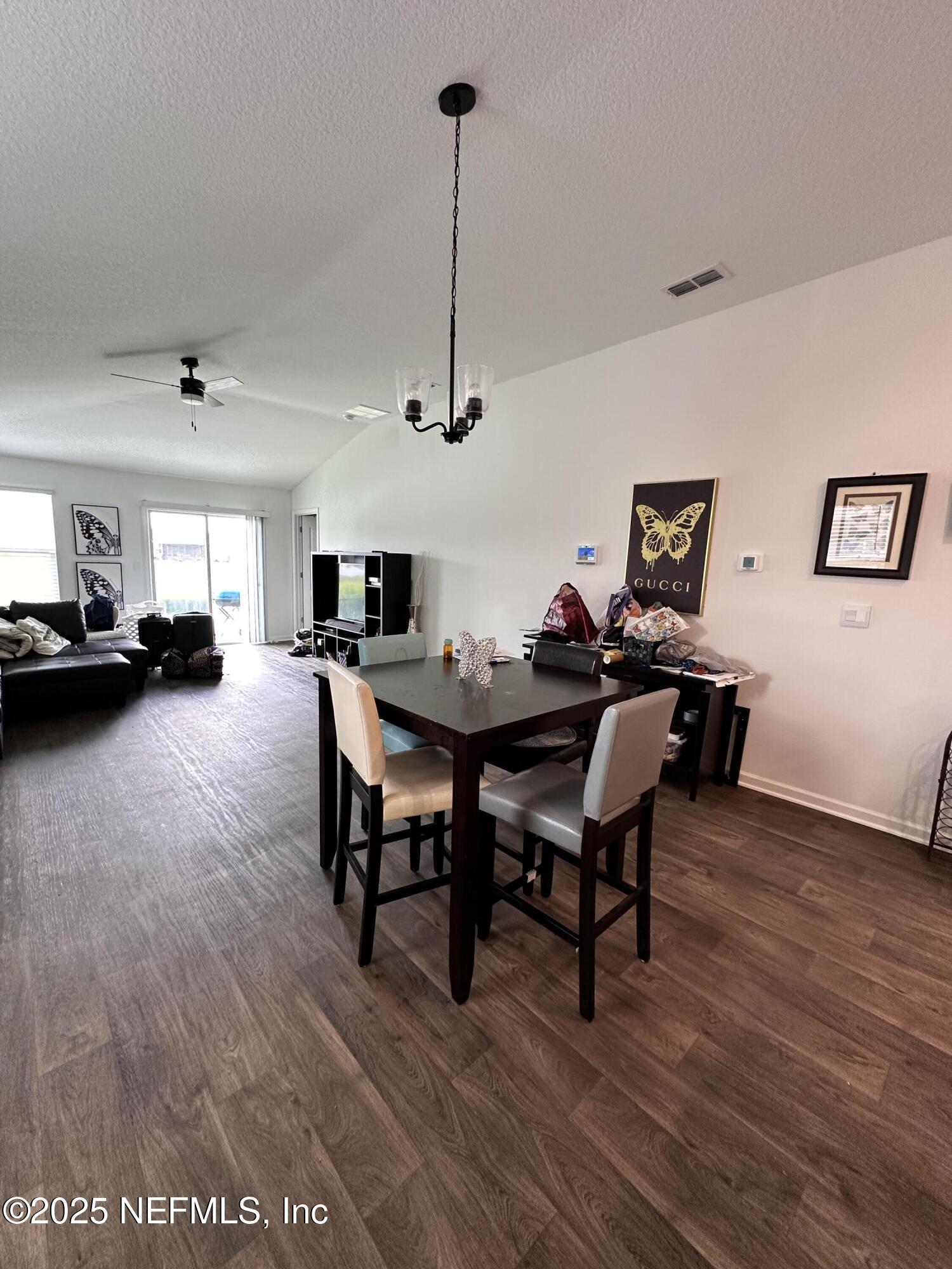 2769 Oak Strm Drive Green Cove Springs, FL 32043 - Photo 4 of 17 a view of a dining room with furniture and wooden floor