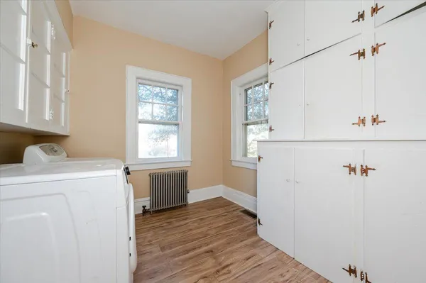 a view of a storage & utility room with a washer dryer