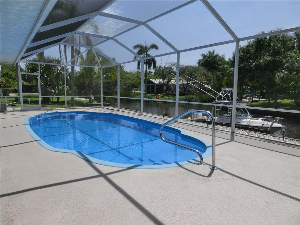 590 Southwest Harbor Street Stuart, FL 34997 - Photo 11 of 14 PRIVATE SCREENED POOL OVERLOOKS WATER