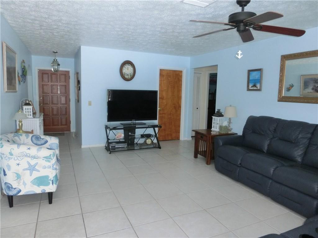 590 Southwest Harbor Street Stuart, FL 34997 - Photo 7 of 14 FAMILY ROOM OVERLOOKS POOL/WATERWAY