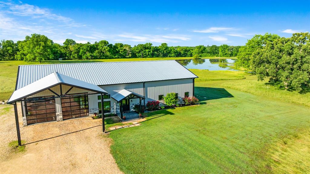 962 County Road Pattonville, TX 75468 - Photo 4 of 37 a view of a house with a swimming pool