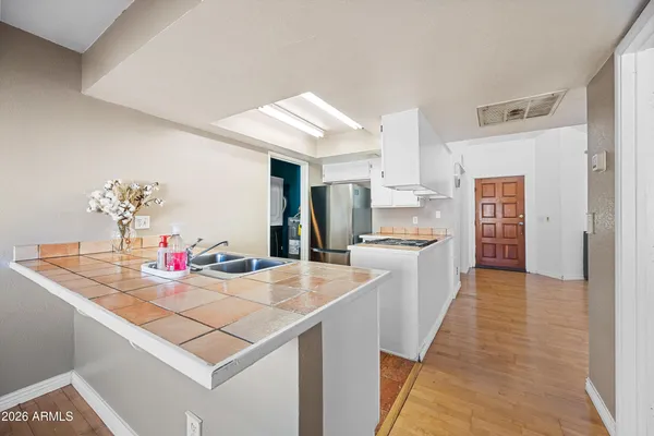 a kitchen with stainless steel appliances granite countertop a stove and a refrigerator