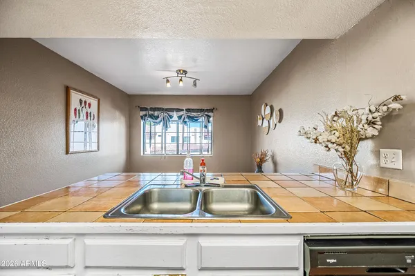 a kitchen with a stove and cabinets