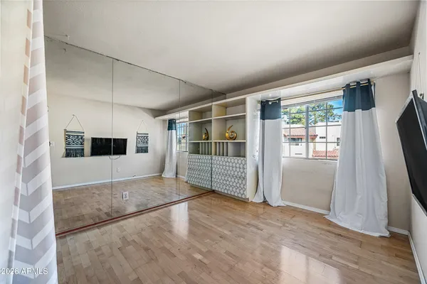 a view of kitchen with cabinets