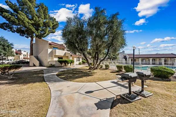 a view of a backyard with sitting area