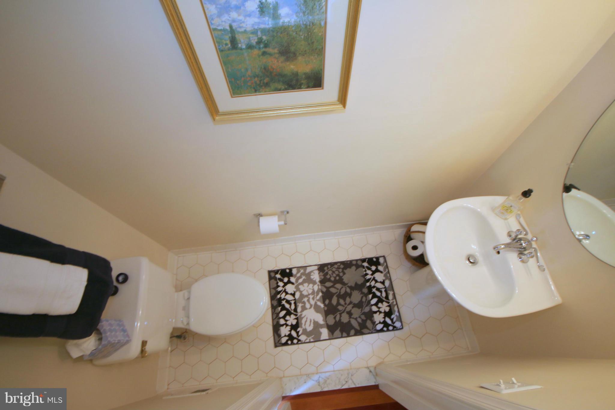 1246 Weatherstone Court Reston, VA 20194 - Photo 8 of 26 a bathroom with a sink mirror and toilet