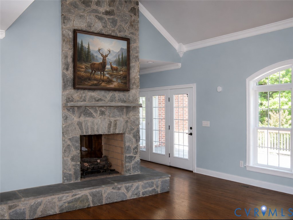 239 Jennings Road Cartersville, VA 23027 - Photo 11 of 26 Stone fireplace with hearth, French doors, arched