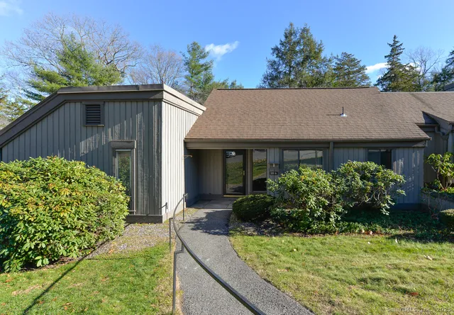 a view of house with yard and entertaining space