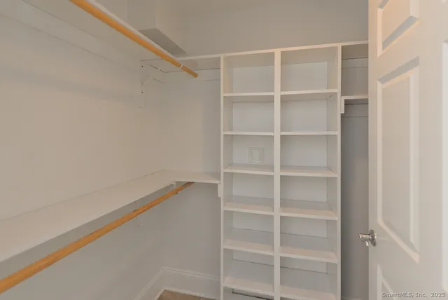 a view of an empty walk in closet