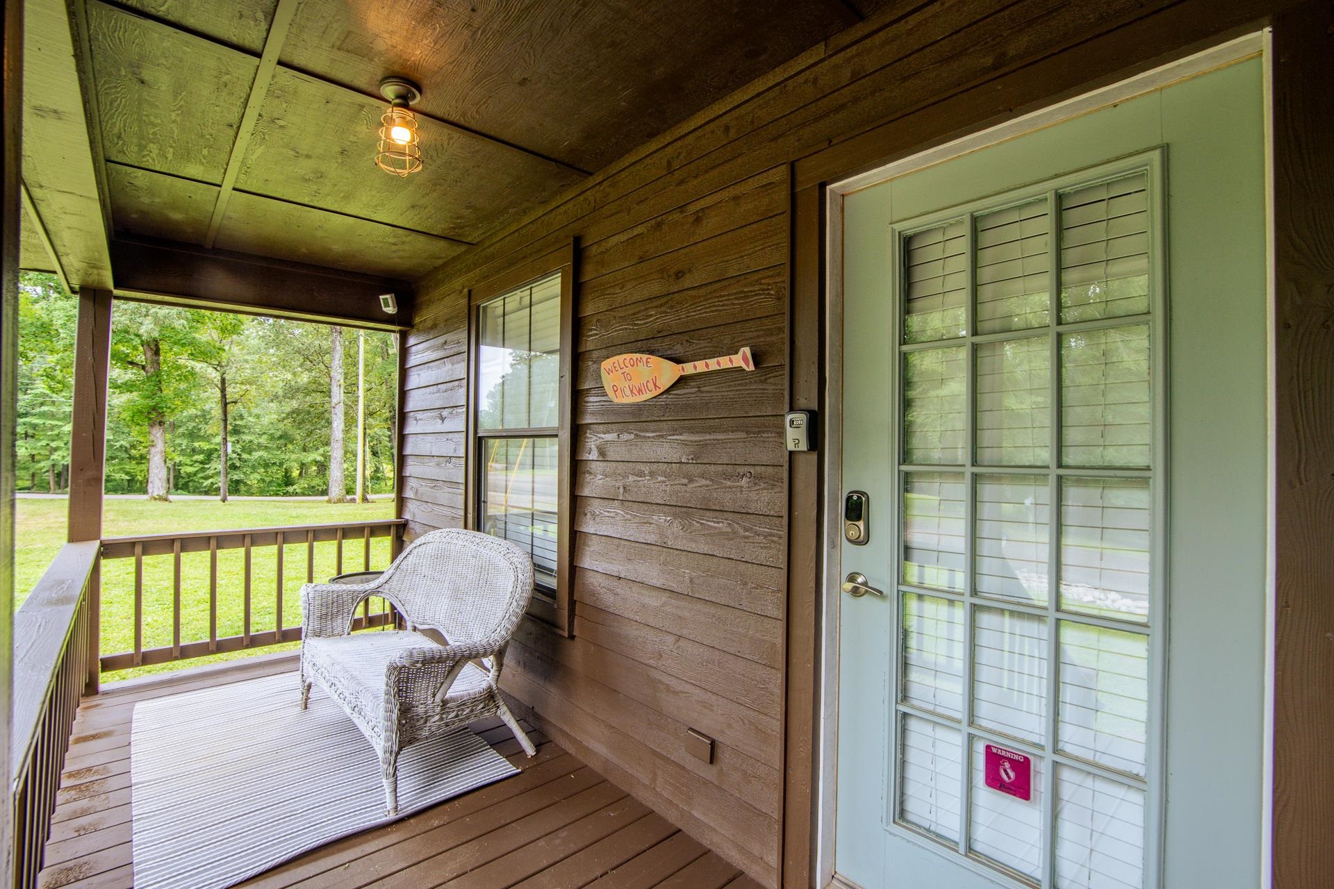 15 Lilly Cove Counce, TN 38326 - Photo 2 of 39 a porch with a table and chairs