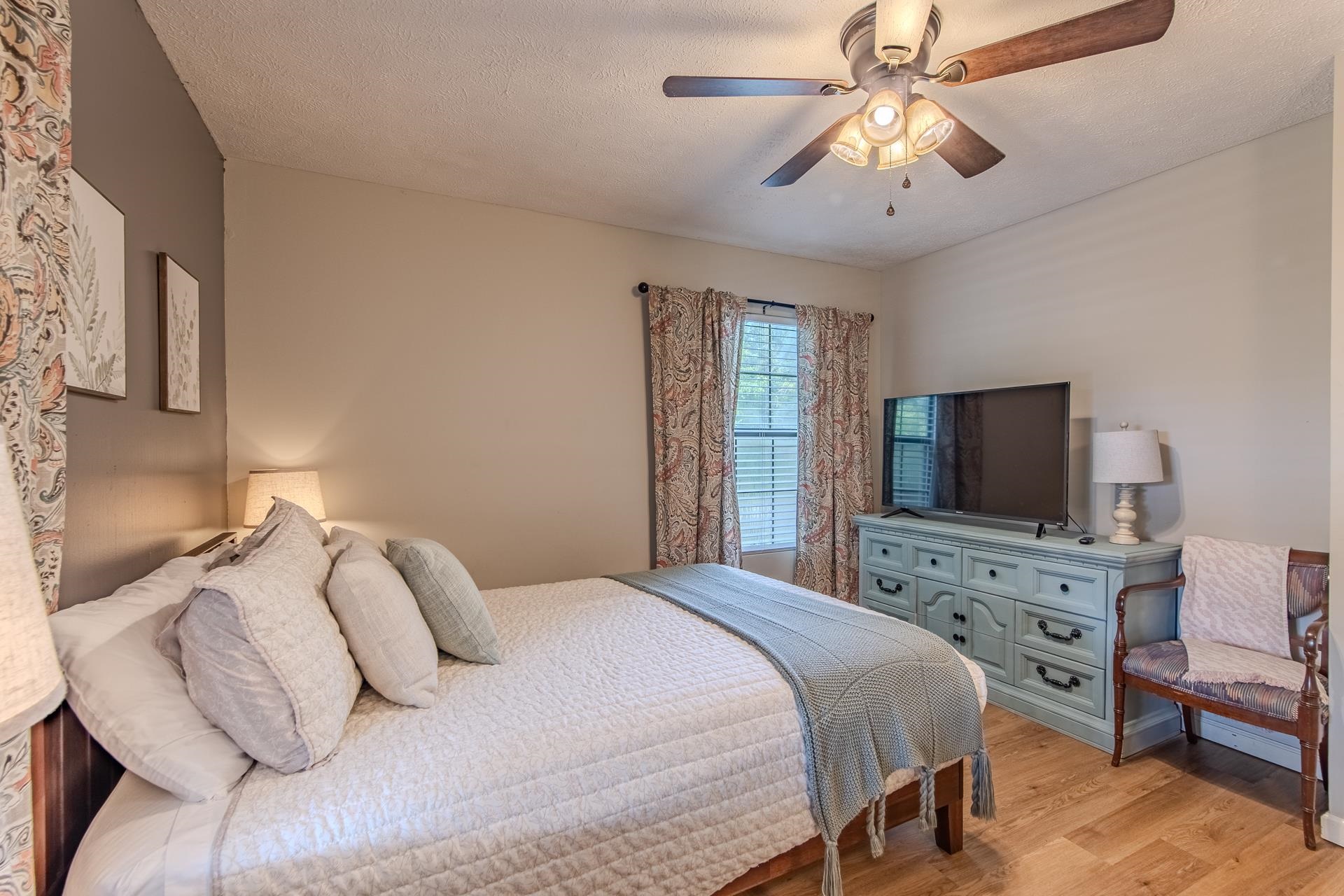 15 Lilly Cove Counce, TN 38326 - Photo 21 of 39 a bedroom with a bed and a flat screen tv