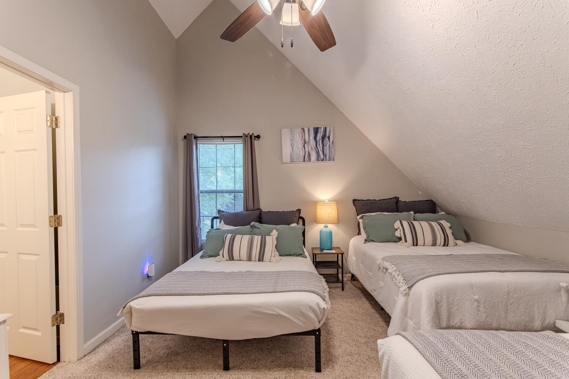 15 Lilly Cove Counce, TN 38326 - Photo 27 of 39 a bedroom with a large bed and a chandelier