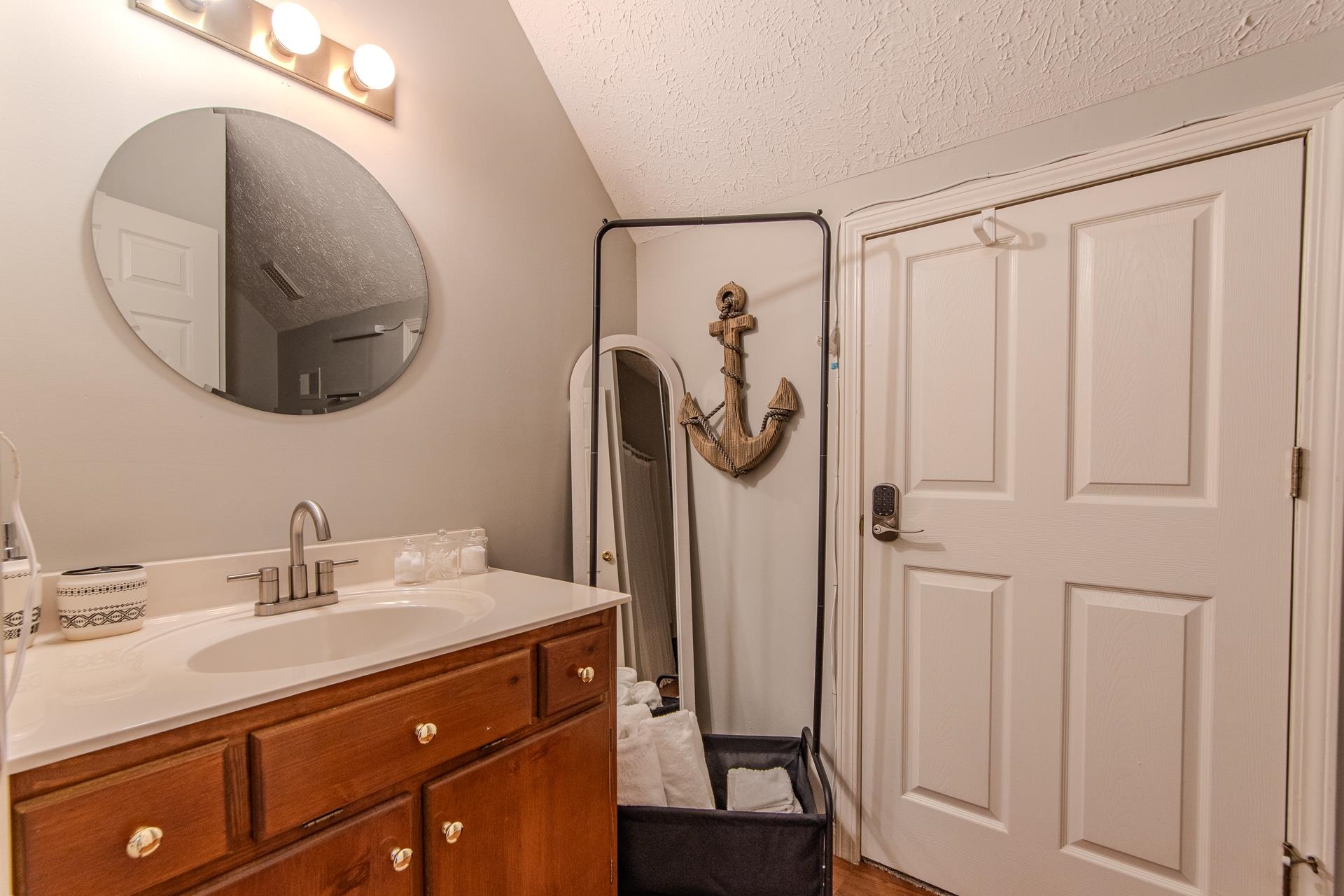 15 Lilly Cove Counce, TN 38326 - Photo 29 of 39 a bathroom with a sink vanity and a mirror