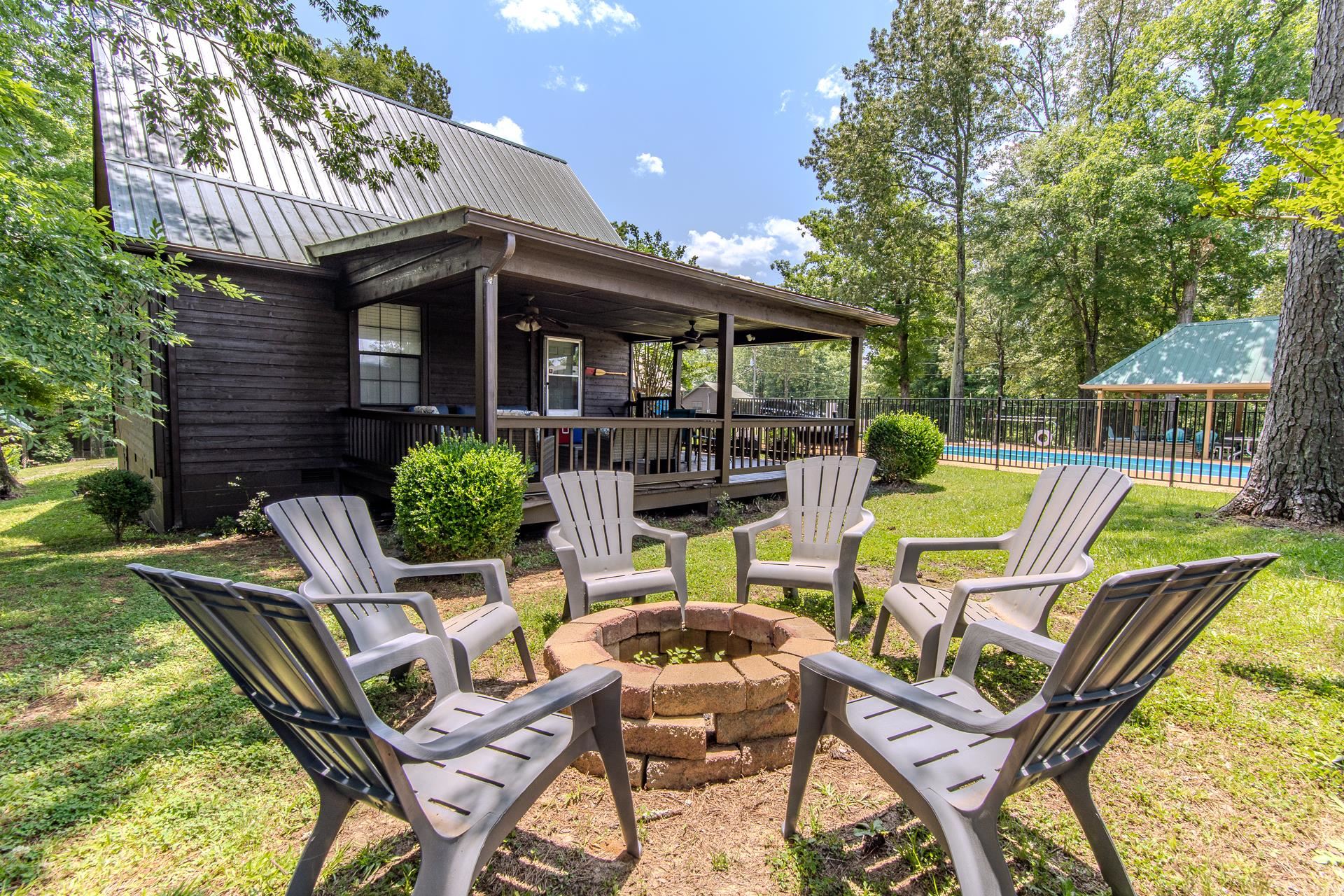 15 Lilly Cove Counce, TN 38326 - Photo 35 of 39 a view of a chairs and table in patio with a wooden fence