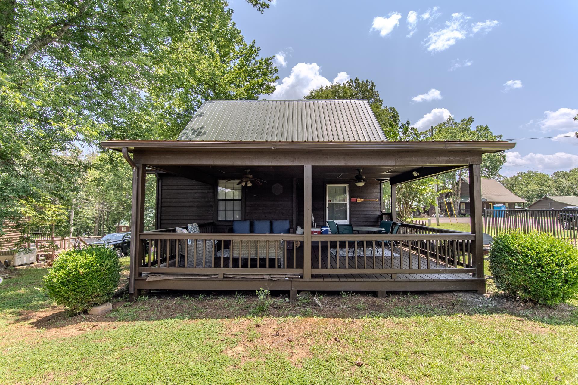15 Lilly Cove Counce, TN 38326 - Photo 36 of 39 a view of a house with a tub and chairs