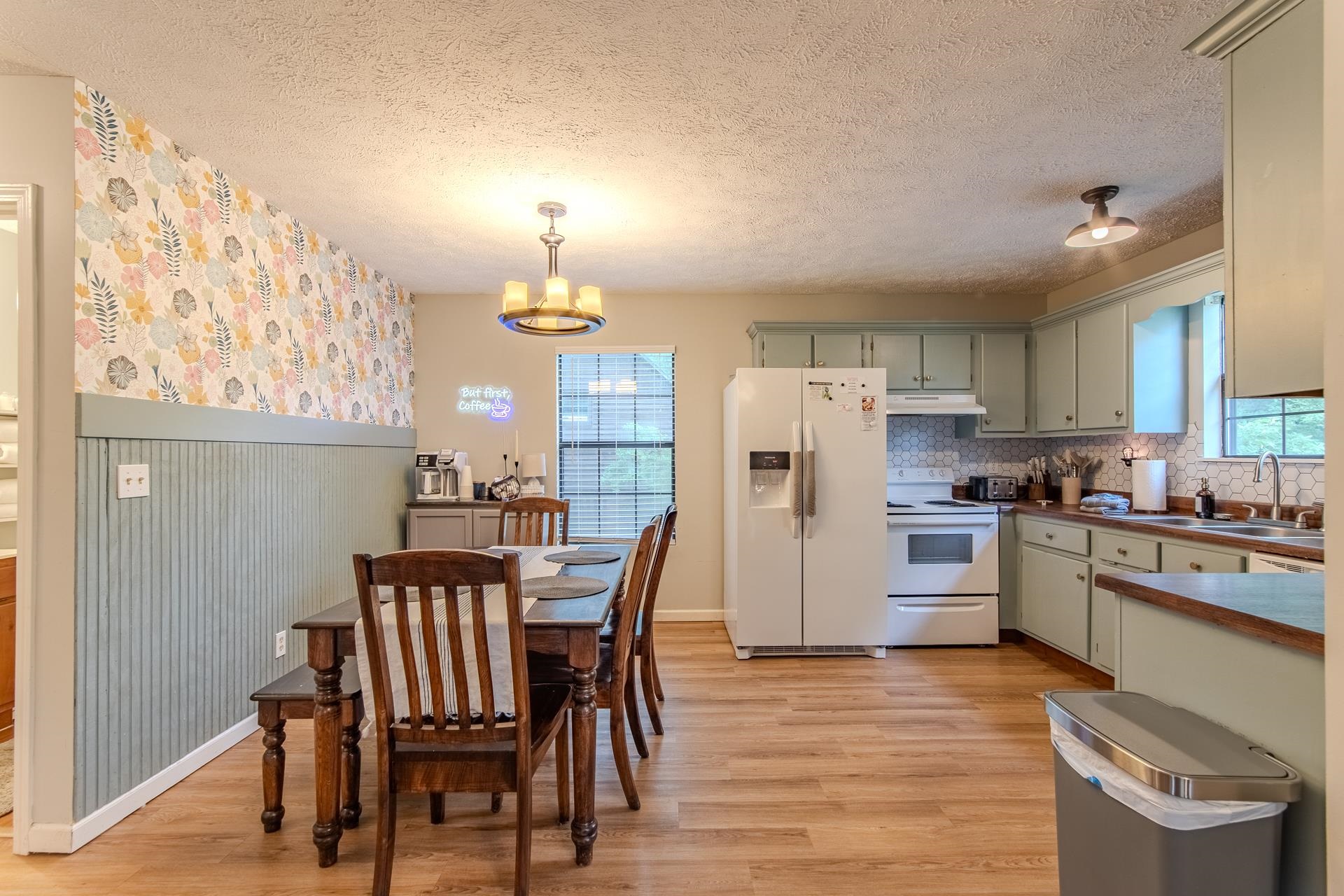15 Lilly Cove Counce, TN 38326 - Photo 7 of 39 a kitchen with refrigerator a stove and wooden floor