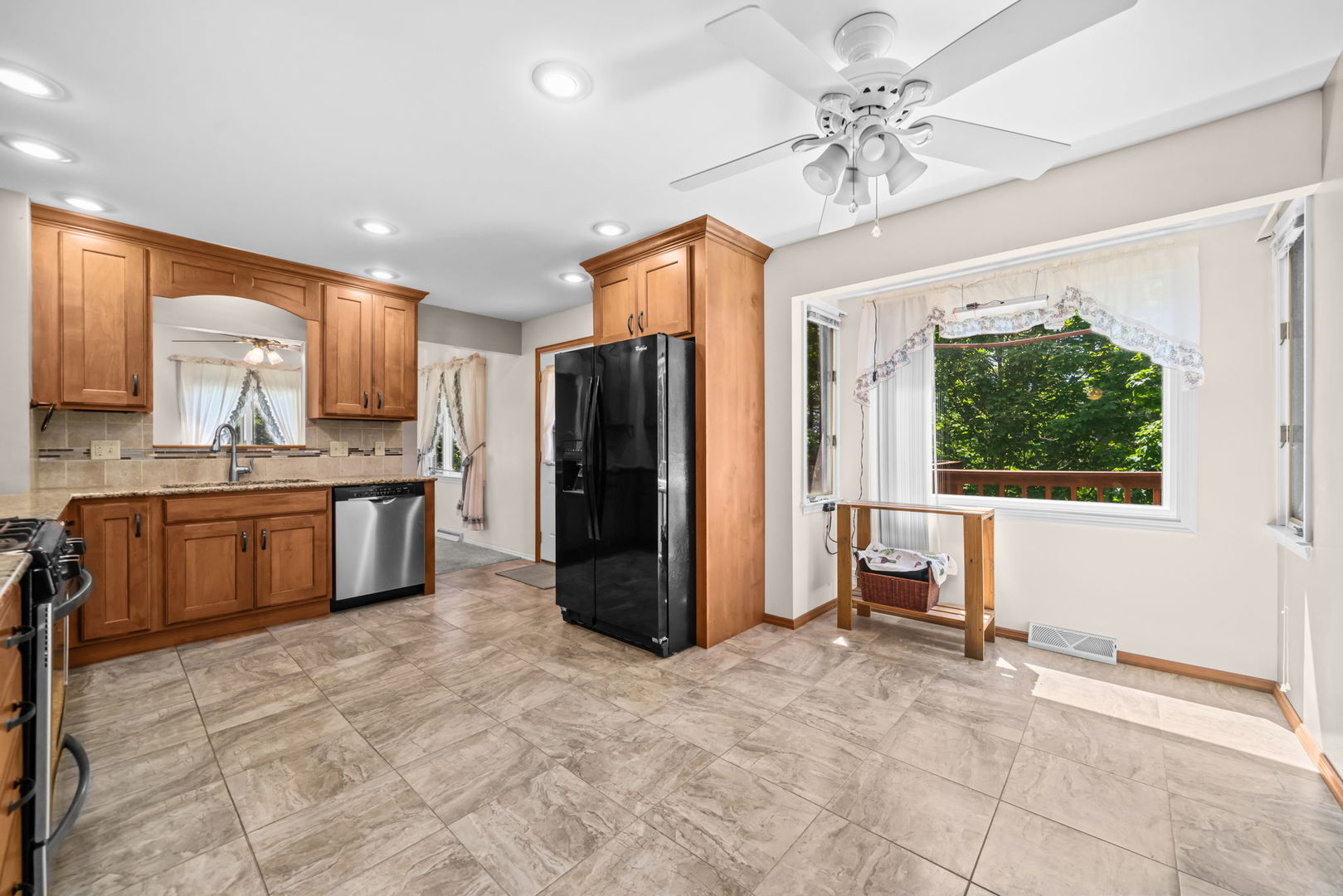 5748 South Skare Road Rochelle, IL 61068 - Photo 7 of 45 a kitchen with stainless steel appliances a refrigerator sink and cabinets