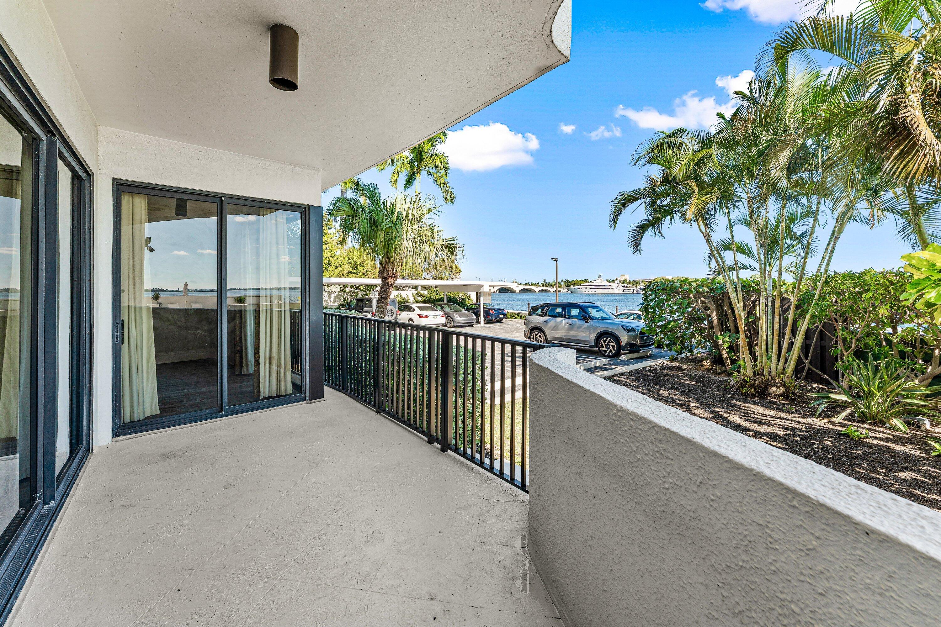 1200 South Flagler Drive, Unit 101 West Palm Beach, FL 33401 - Photo 33 of 44 a view of a living room and a balcony