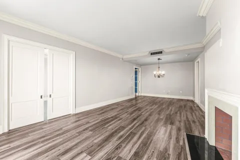 a view of a living room and a balcony
