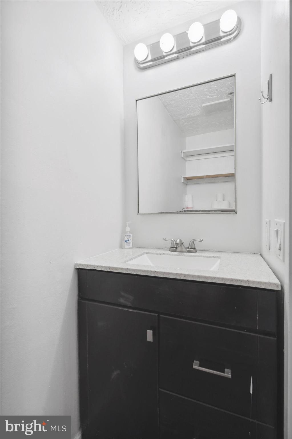 12 Letitia Street, Unit 103 Philadelphia, PA 19106 - Photo 14 of 21 a bathroom with a sink and a mirror