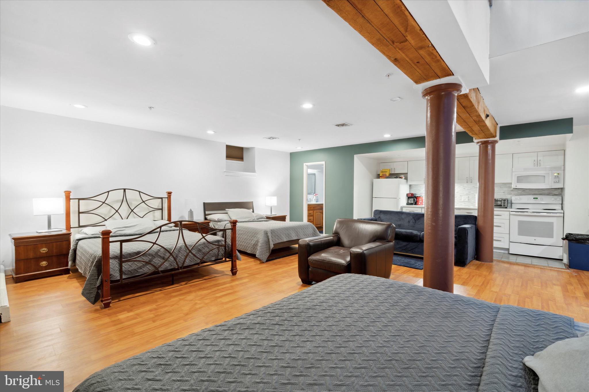 12 Letitia Street, Unit 103 Philadelphia, PA 19106 - Photo 20 of 21 a bedroom with furniture and a wooden floor