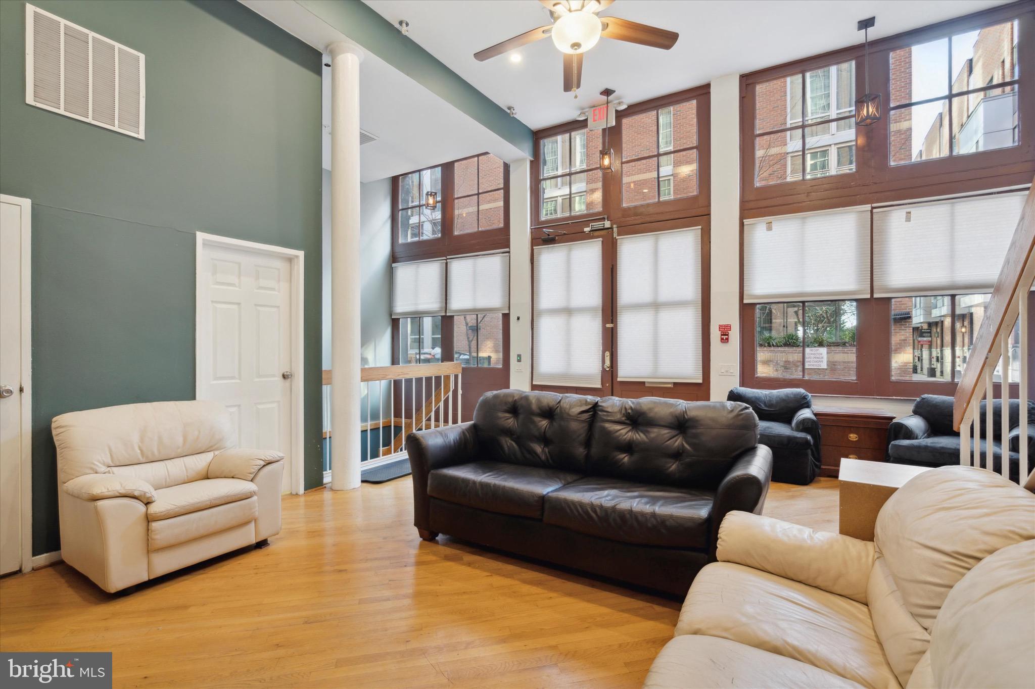 12 Letitia Street, Unit 103 Philadelphia, PA 19106 - Photo 9 of 21 a living room with furniture and a large window