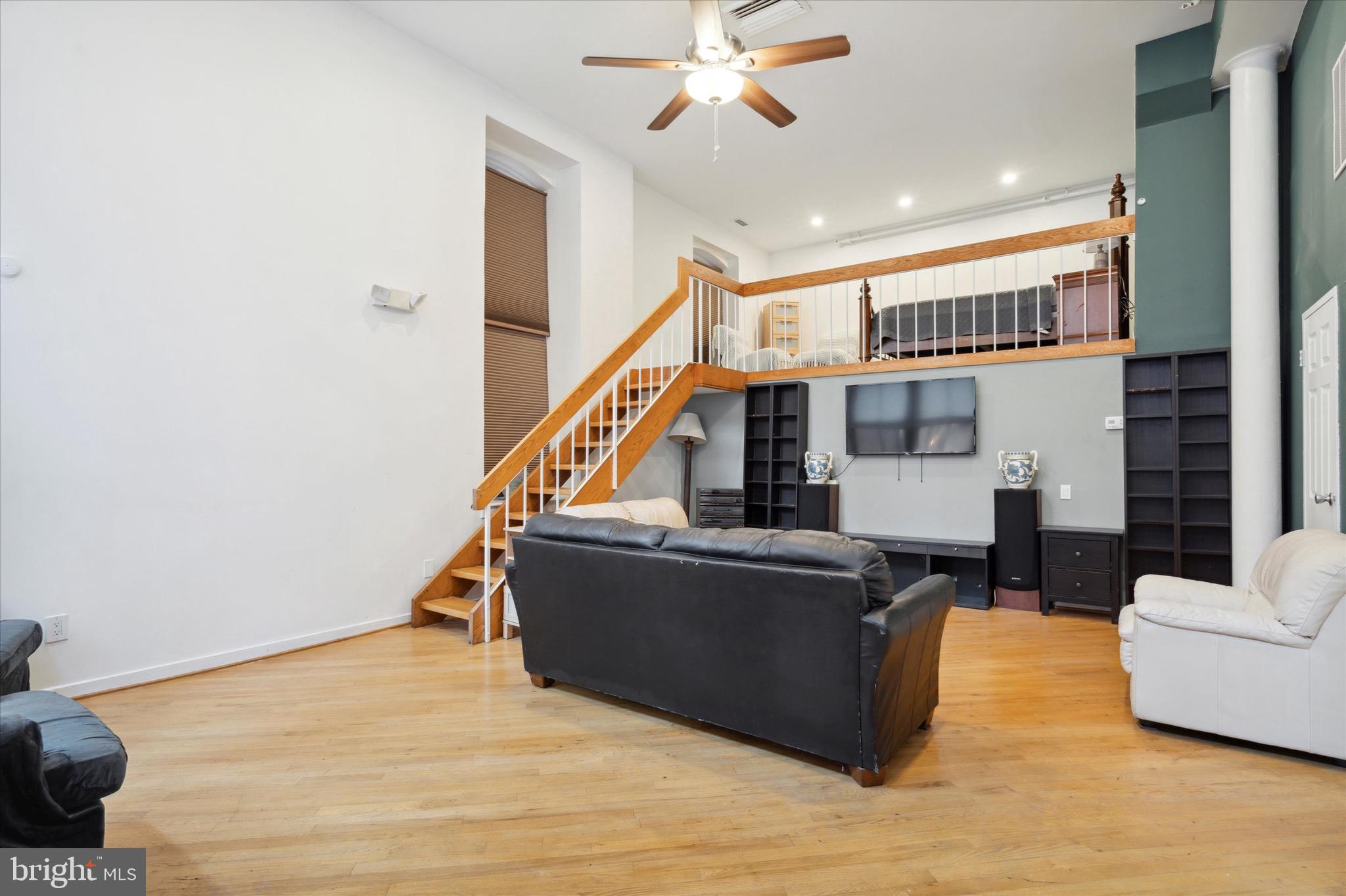 12 Letitia Street, Unit 103 Philadelphia, PA 19106 - Photo 10 of 21 a living room with furniture and a wooden floor
