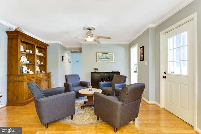 7713 Schelhorn Road Alexandria, VA 22306 - Photo 15 of 43 Family room with exit to wrap around porch.