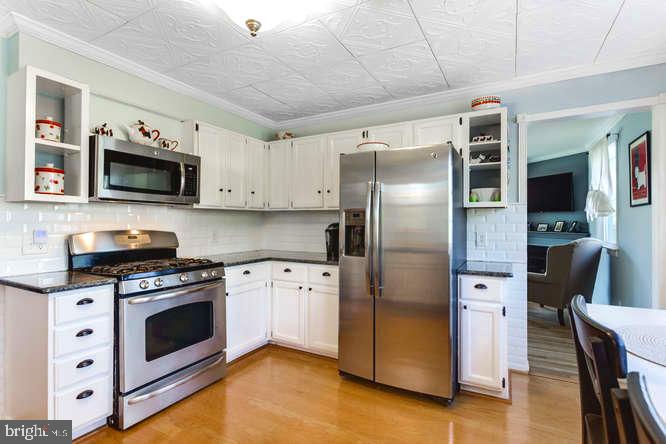 7713 Schelhorn Road Alexandria, VA 22306 - Photo 7 of 43 Stainless steel and granite countertops.