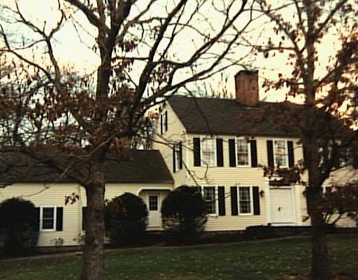 16 Comstock Court Ridgefield, CT 06877 - Photo 1 of 1 a front view of a house with a yard