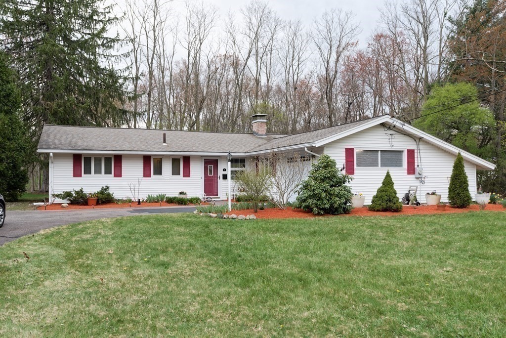 54 Gregory Road Framingham, MA 01701 - Photo 1 of 41 a front view of a house with a yard and garage