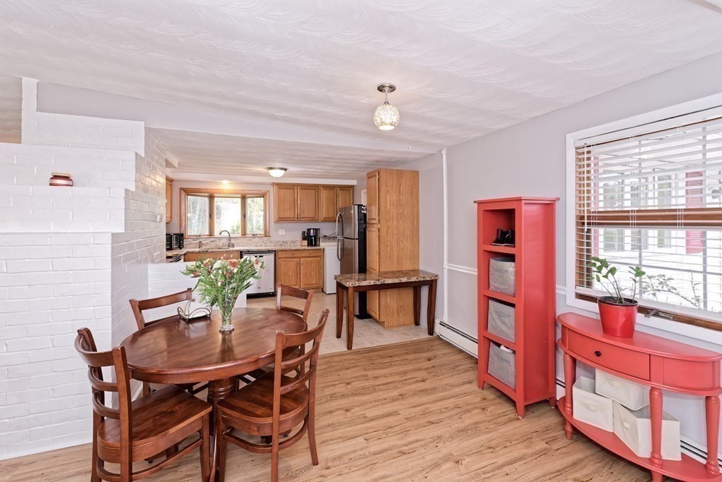 54 Gregory Road Framingham, MA 01701 - Photo 12 of 41 a view of a dining room with furniture and wooden floor