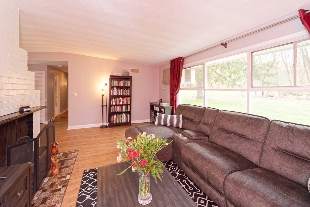 54 Gregory Road Framingham, MA 01701 - Photo 15 of 41 a living room with furniture and a large window