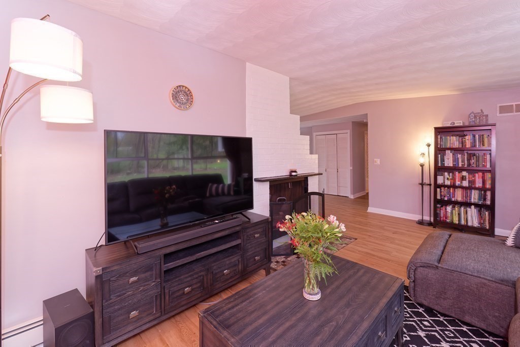 54 Gregory Road Framingham, MA 01701 - Photo 17 of 41 a living room with furniture and wooden floor