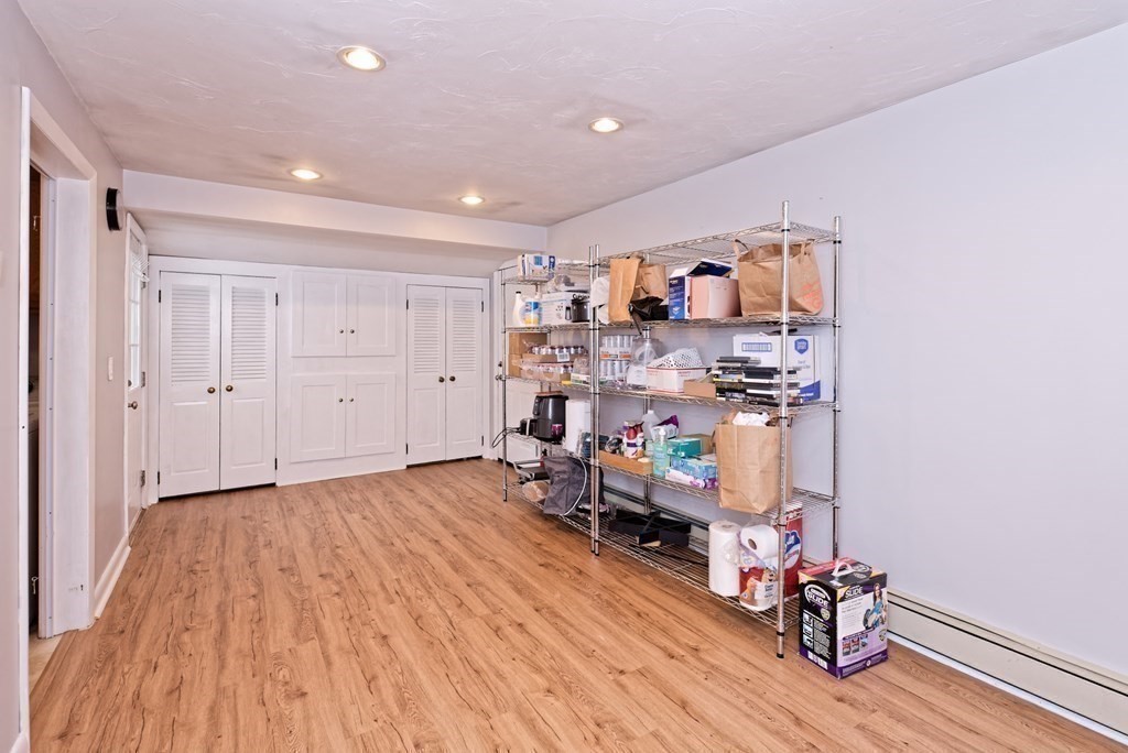 54 Gregory Road Framingham, MA 01701 - Photo 23 of 41 a view of a workspace with furniture and wooden floor