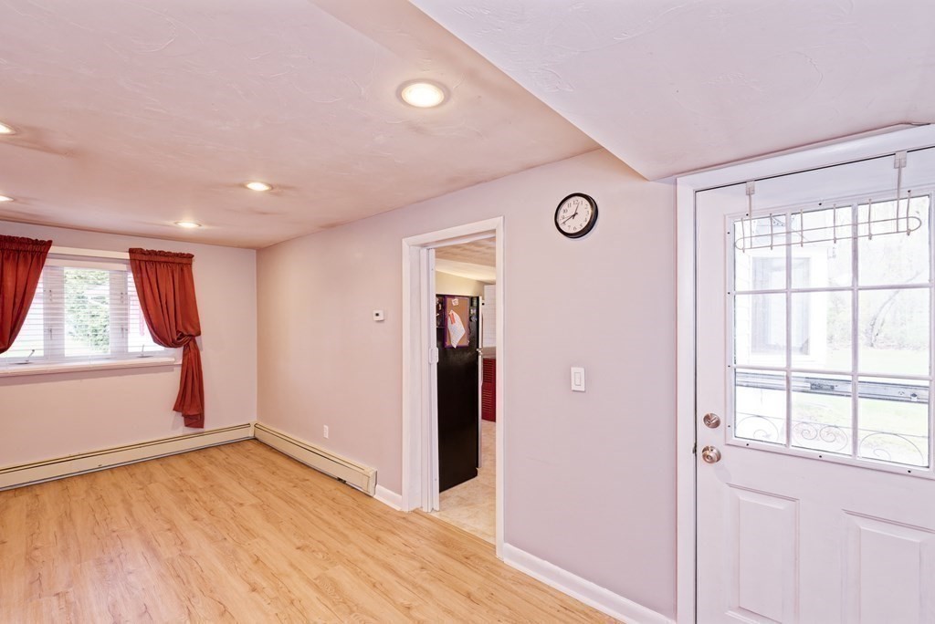 54 Gregory Road Framingham, MA 01701 - Photo 24 of 41 a view of empty room with wooden floor and fan
