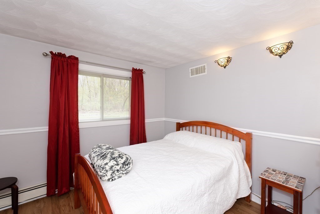 54 Gregory Road Framingham, MA 01701 - Photo 30 of 41 a bedroom with a bed and a window