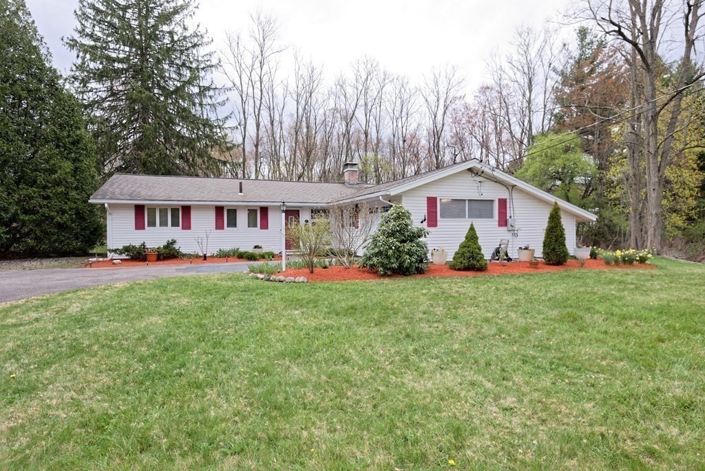 54 Gregory Road Framingham, MA 01701 - Photo 3 of 41 a view of a house with a yard and sitting area