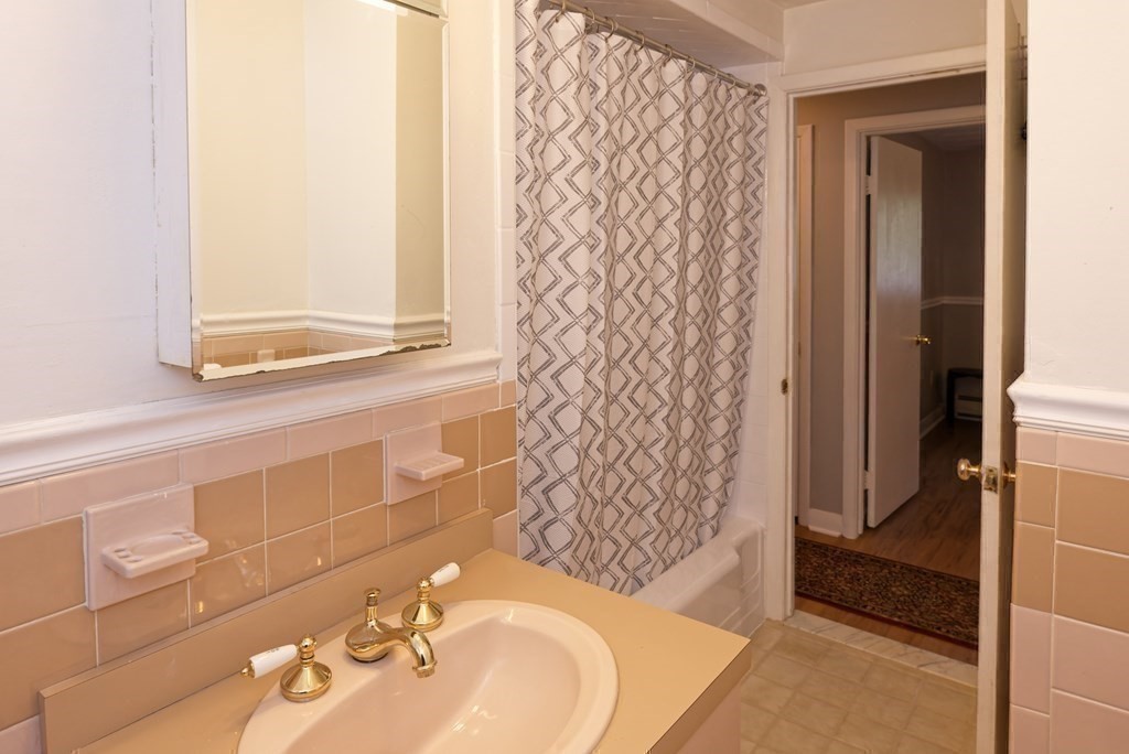 54 Gregory Road Framingham, MA 01701 - Photo 32 of 41 a bathroom with a shower and a sink