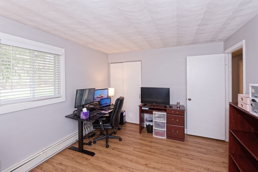 54 Gregory Road Framingham, MA 01701 - Photo 34 of 41 a view of a workspace with furniture and a window