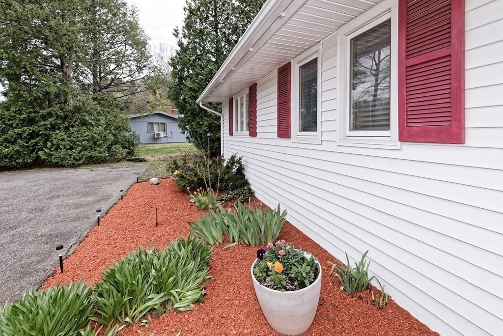 54 Gregory Road Framingham, MA 01701 - Photo 6 of 41 a front view of a house with a garden